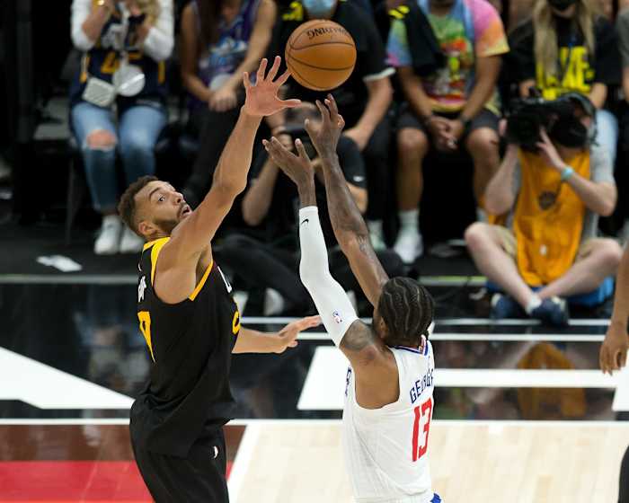 Rudy Gobert (27) tries to block a shot by Paul George (13)